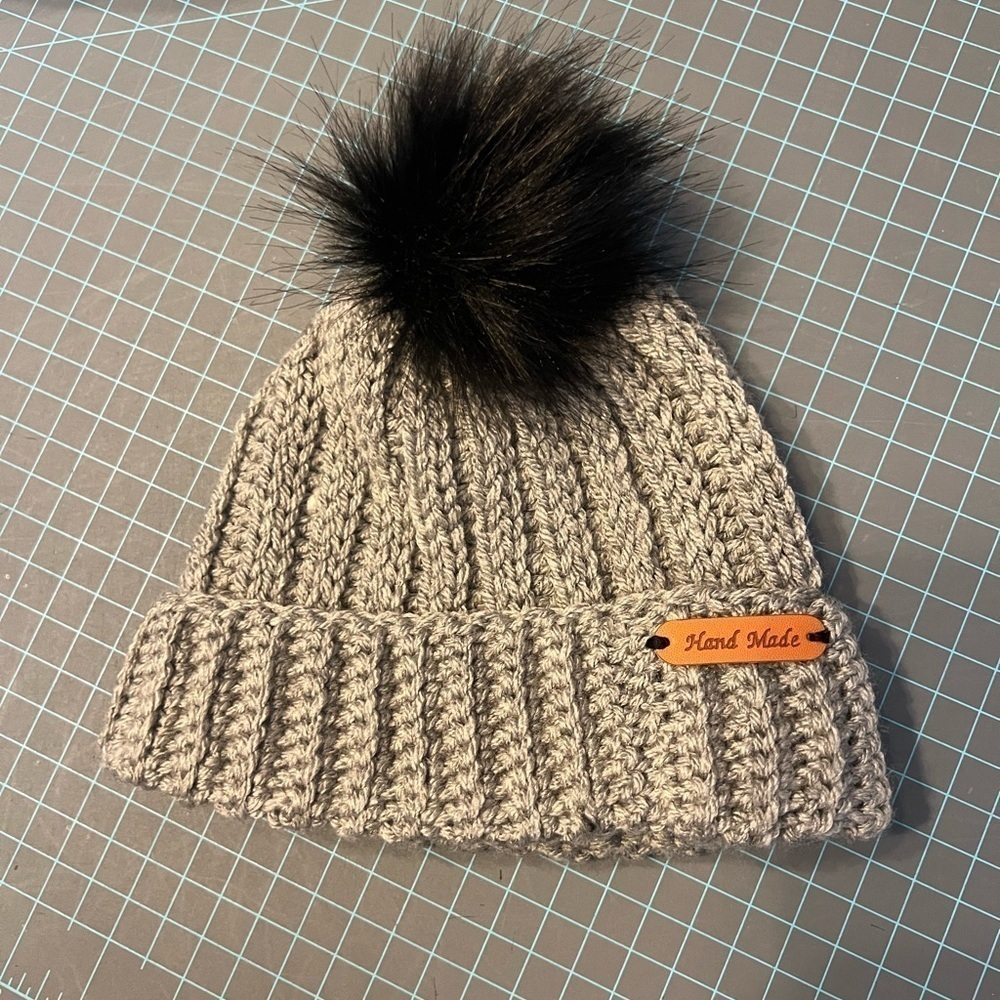 Handmade crocheted beanie hat. Toddler size. Gray with black Pom Pom.